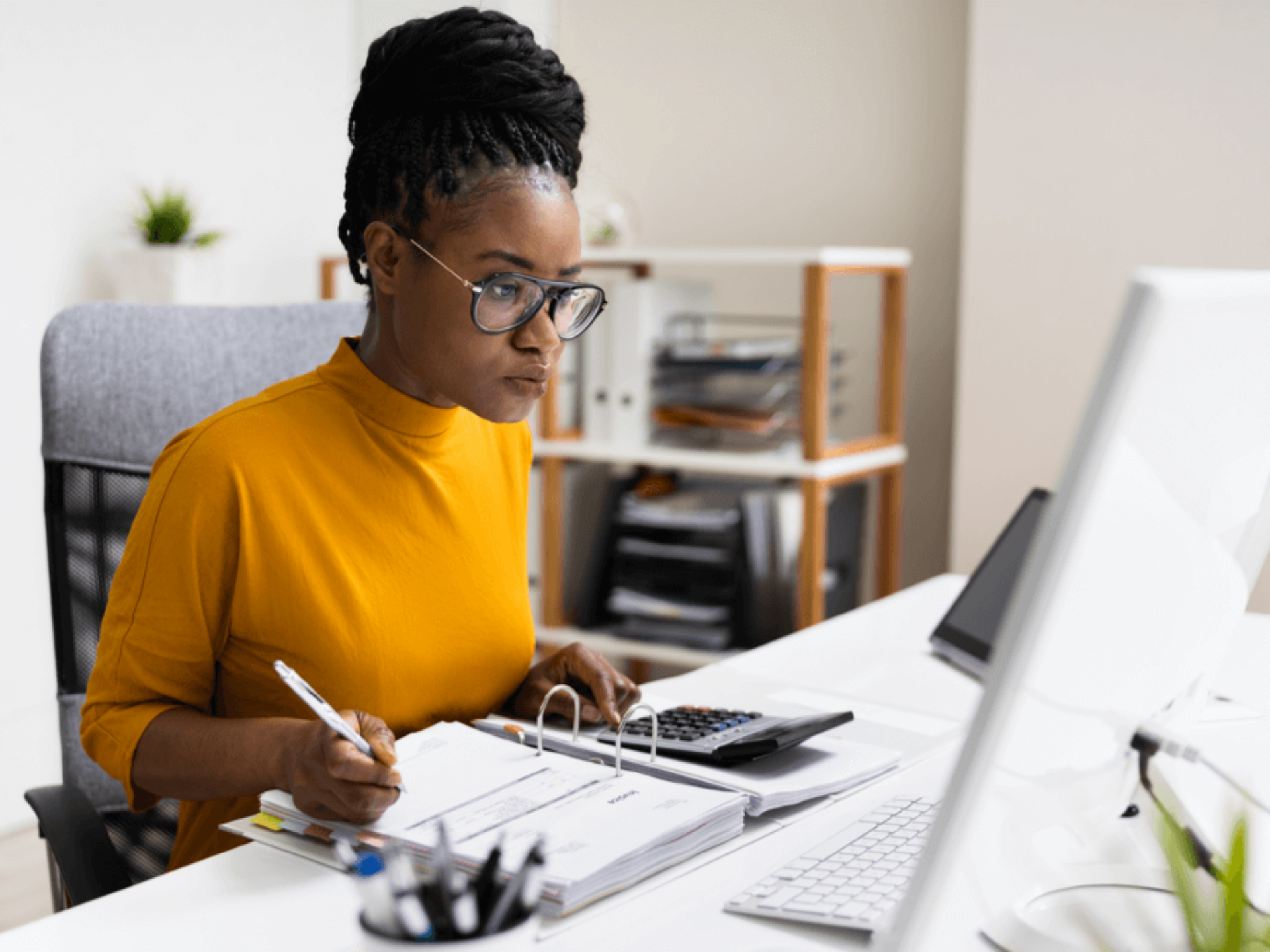 Woman working at a desktop computer