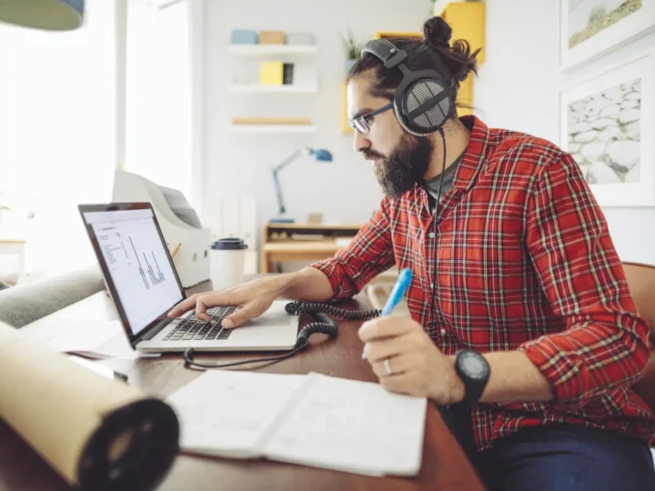 Man working at a laptop in a home office