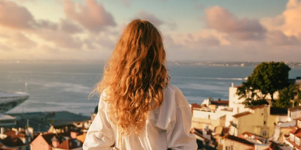 Lady looking out to see in Portugal