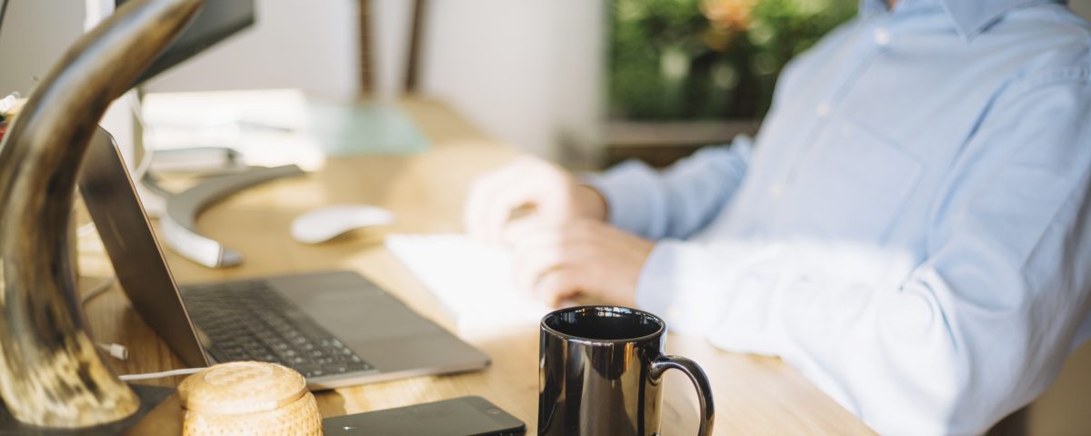 mug-standing-near-working-man